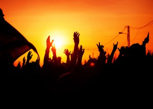 Revolution, people protest against government, man fighting for rights, silhouettes of hands up in the sky, threat of war